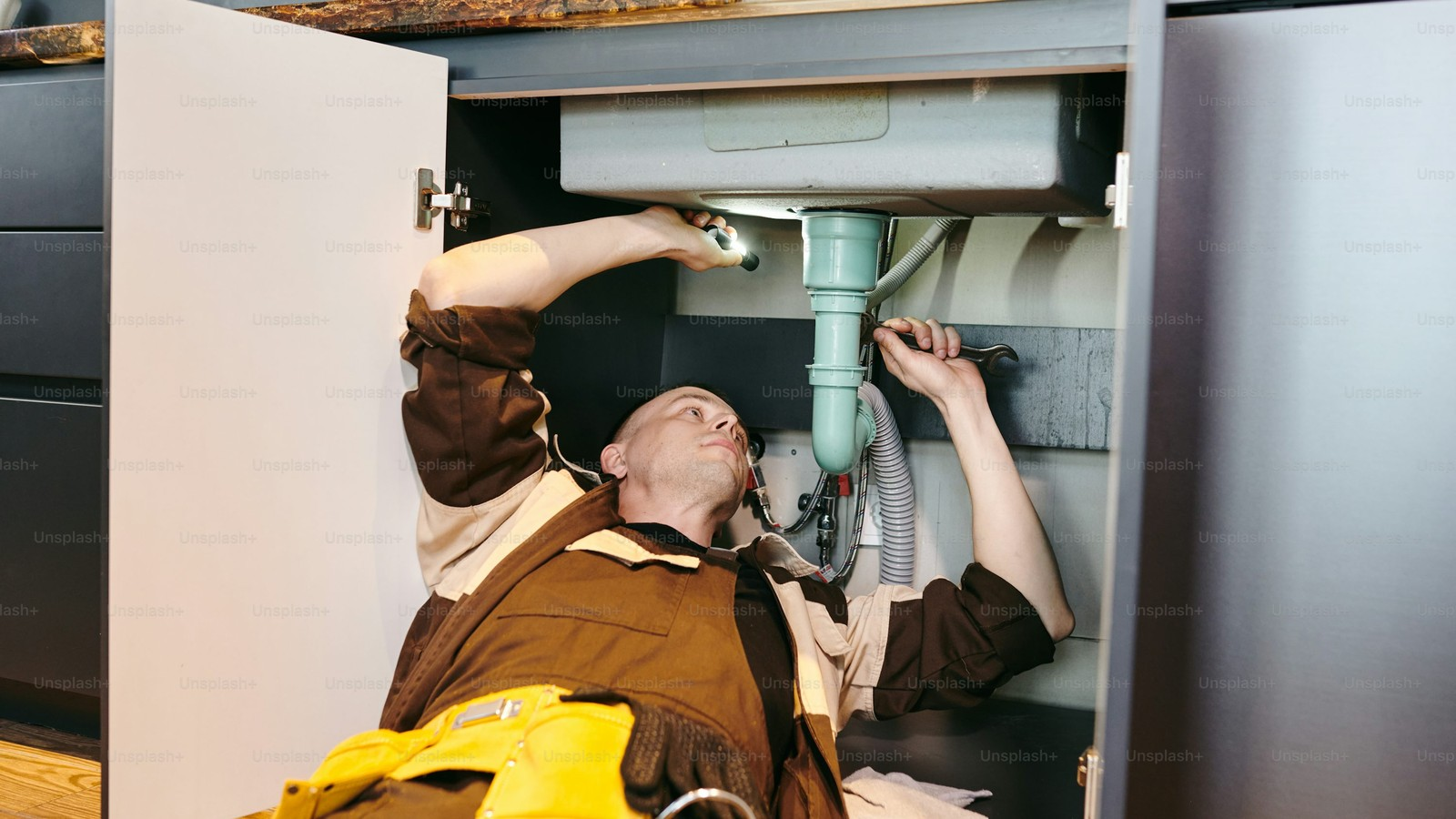 Technician inspecting a frozen indoor plumbing line